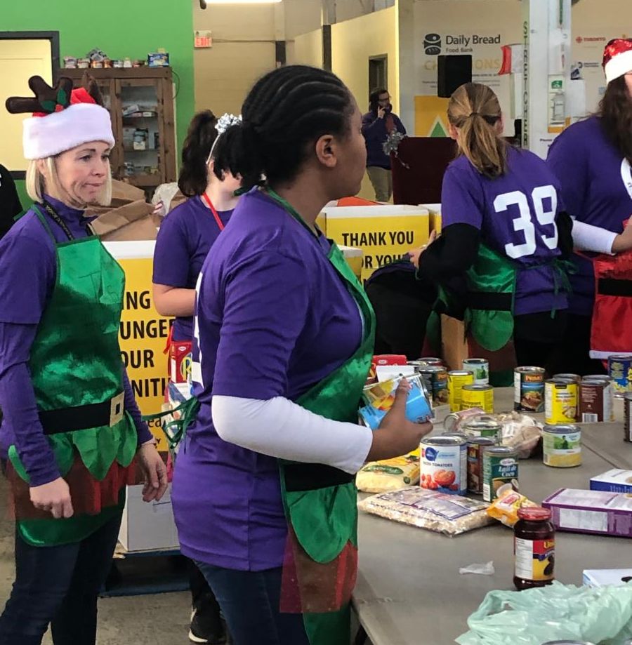 Female student holding cans of food 