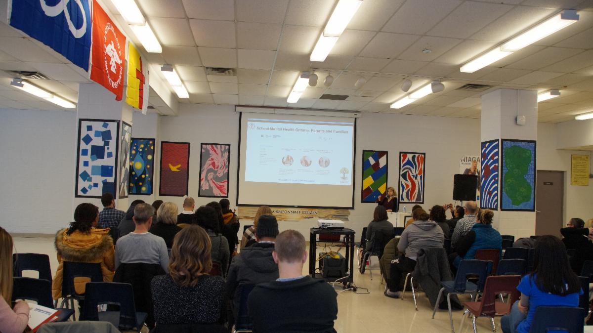 Female adult speaking to parents about anxiety in children and how to help