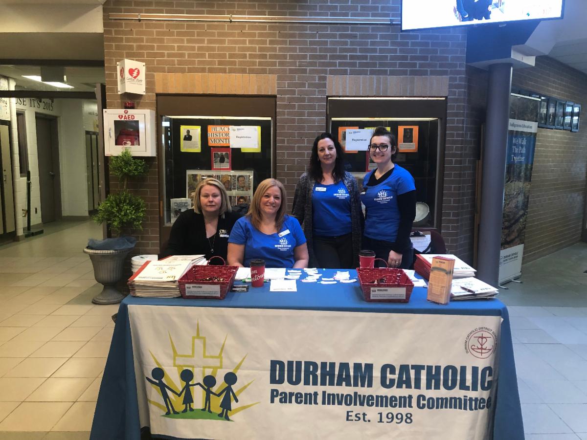 Parent committee members welcoming people to the Mental Health Conference