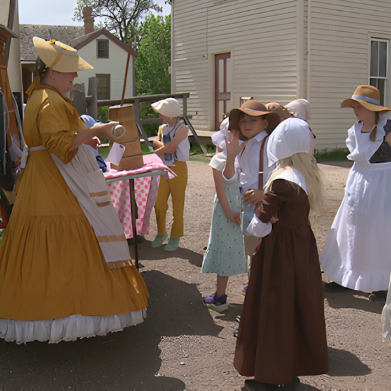 Adult and children in costumes from historical time period