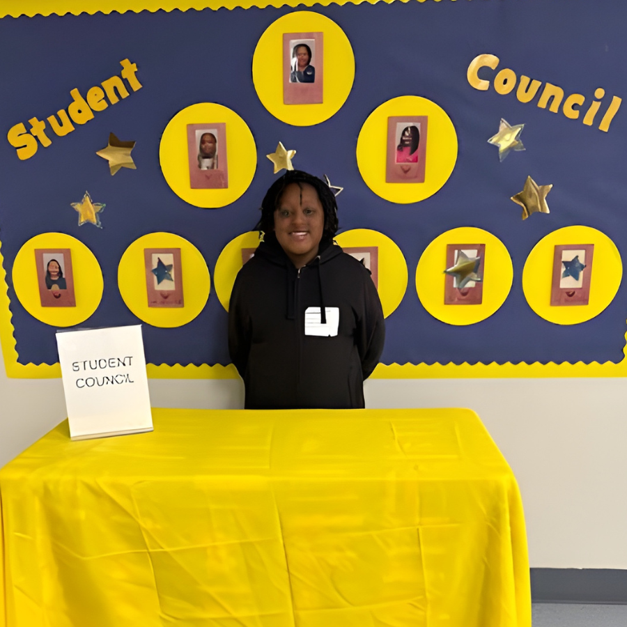 Student standing at the Student Council table