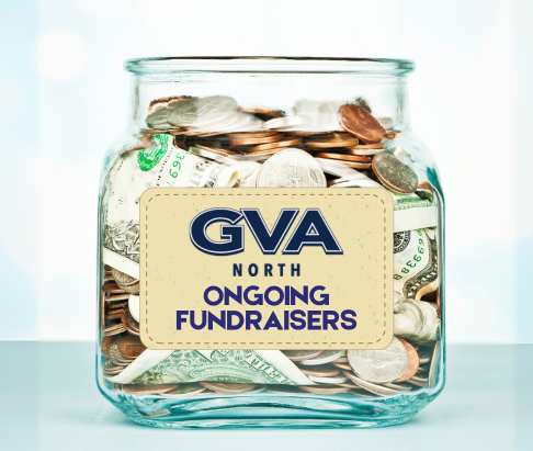 Glass jar filled with money and has a label with GVA North logo and Ongoing Fundraisers