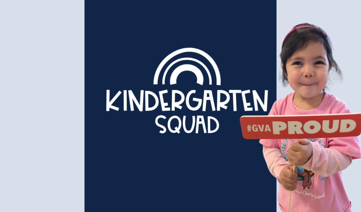 Kindergarten squad with smiling girl holding gvaproud sign