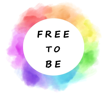 watercolor rainbow with a white circle in the middle and text that reads Free to Be