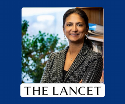 Dr. Mitra smiling alongside the logo for The Lancet