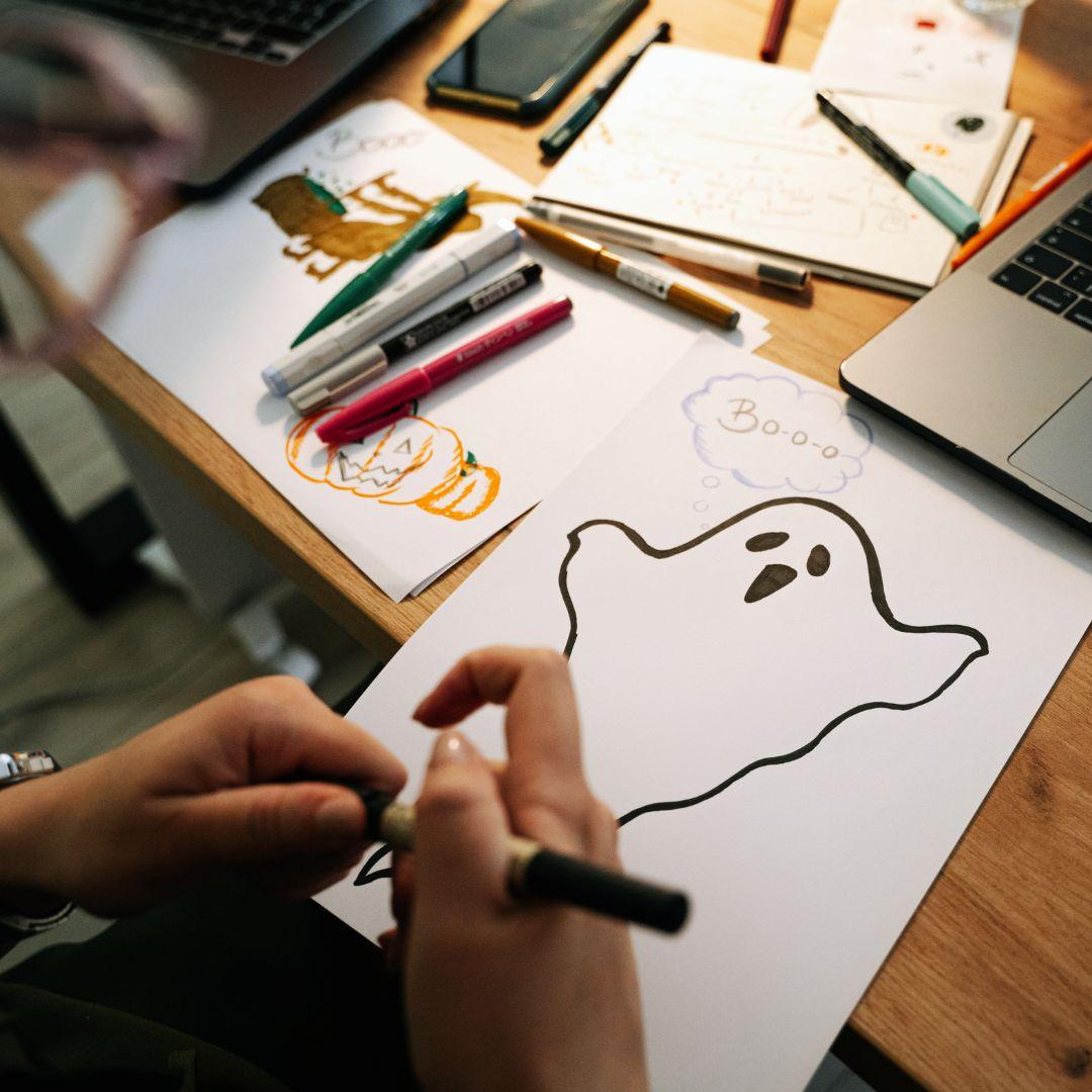 A child draws a spooky picture.