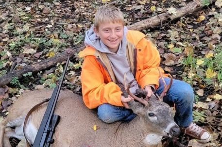 Youth hunter with buck.jpg
