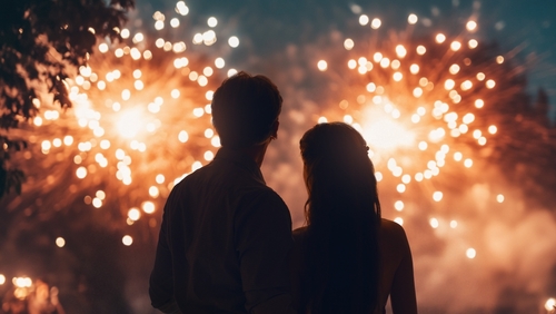 Happy loving couple watching fireworks.