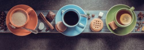 cup of coffee_ cacao and tea on table background