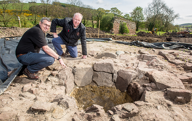 Gary Haggart _left__ distillery manager_ and Drew McKenzie Morris _left_ beside what is believed to be a medieval whisky still.