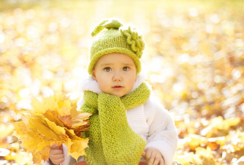 baby_in_fall_leaves.jpg
