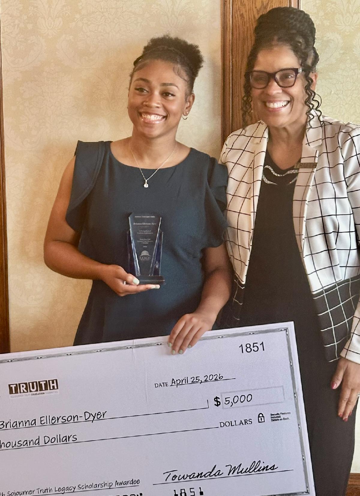 Board Chair Towanda Mullins and scholarship winner