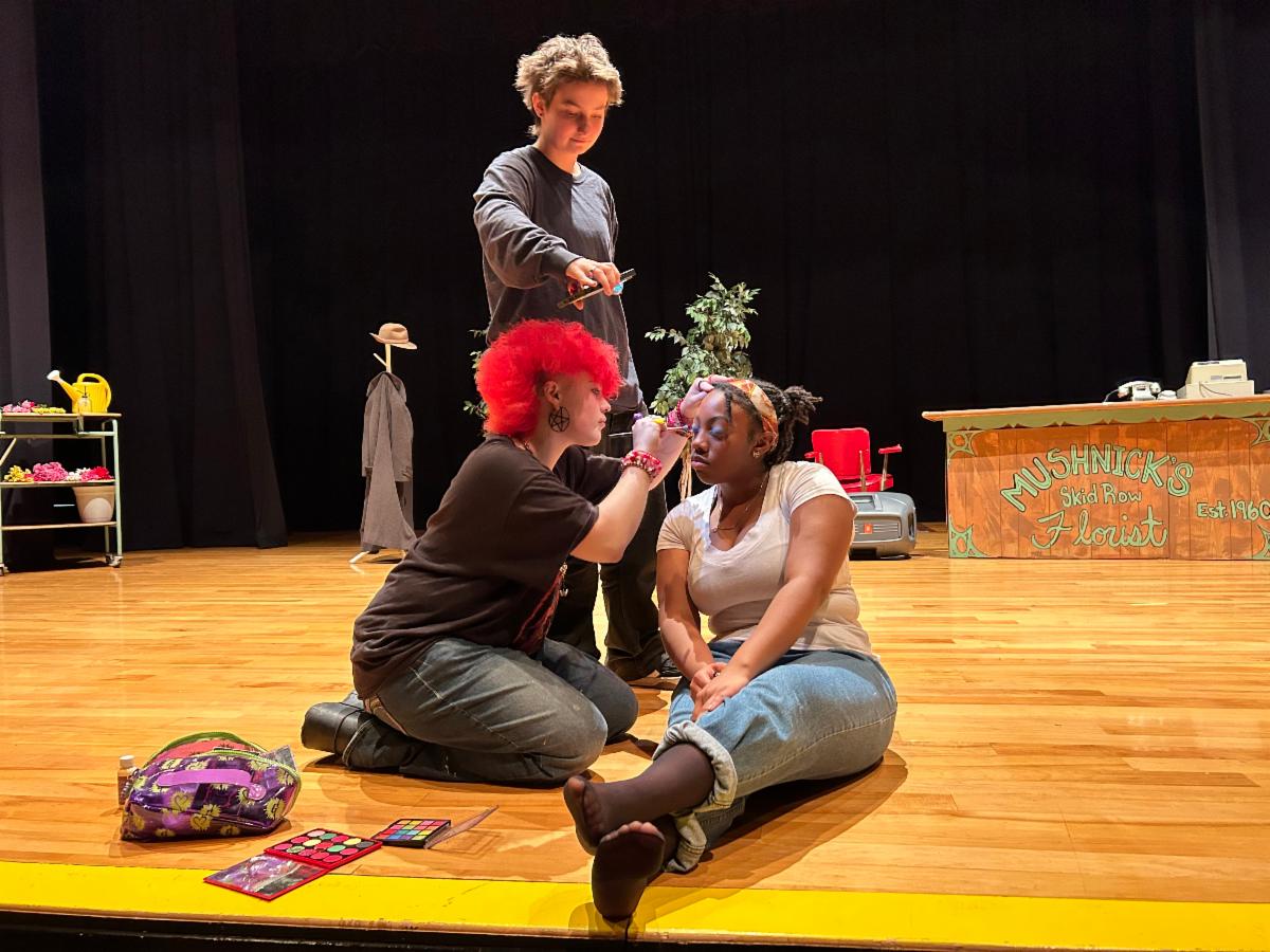 Eriden Rose (plays the primary villian) applying makeup to Amaiya Davis 