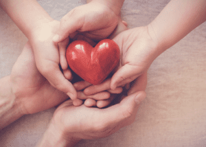 Hands-holding-heart-300x214.png