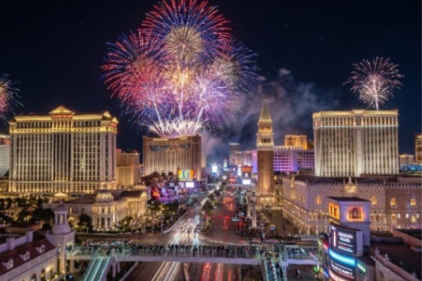 Vibrant fireworks exploding over Caesars Palace and the Venetian during the Center Strip Las Vegas Summer Fireworks