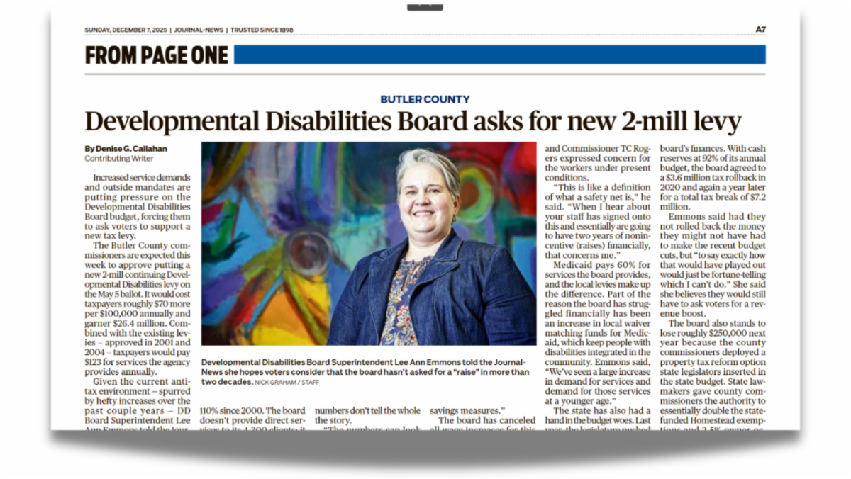 Digital clipping from a newspaper shows a woman smiling broadly. The headline reads Developmental Disabilities Board asks for new 2.0 Mills Levy