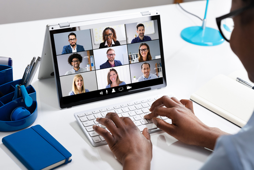 Woman Working From Home Having Group Videoconference On Laptop