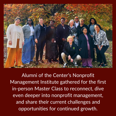 Participants in the 2025 Nonprofit Management Institute Master Class pose for a group photo in front of a colorful autumn tree.