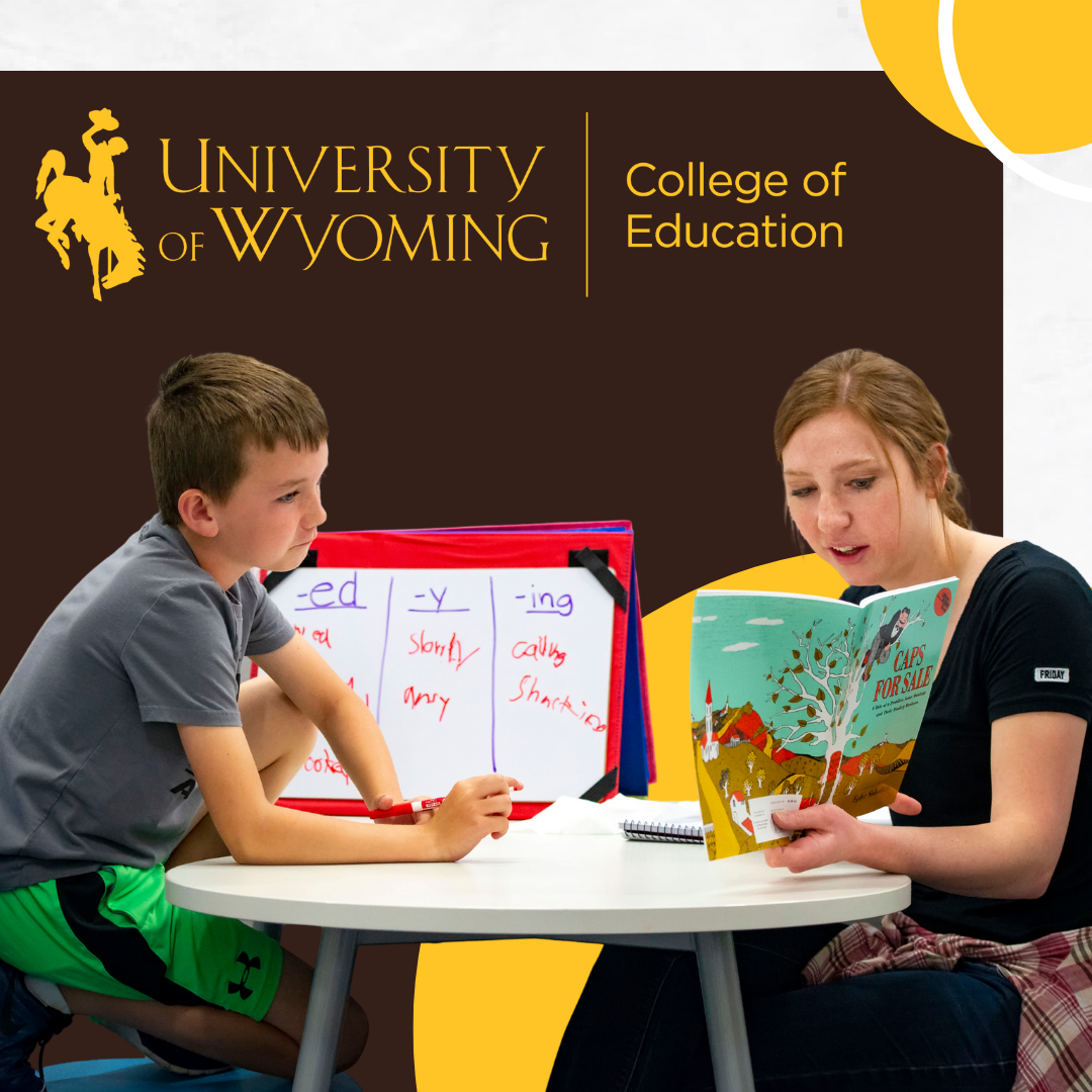 Photo of teacher working with student on reading..