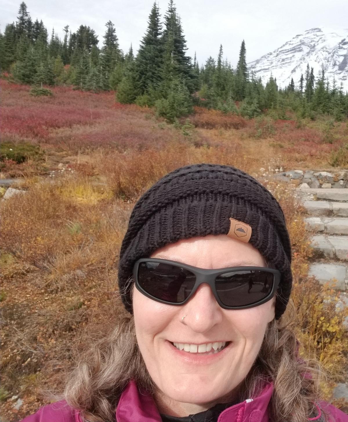 Image of Stacy Ewing at base of hiking trail at Mt. Rainier.