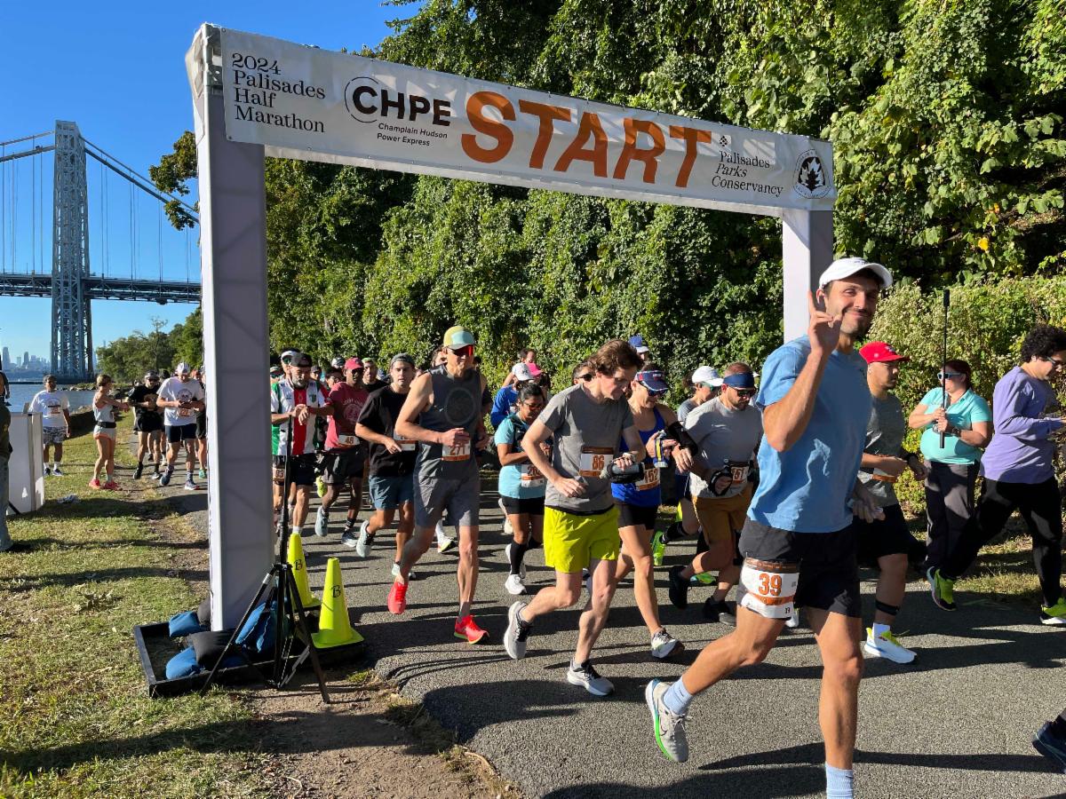 Runners crossing the start line at the 2024 Palisades Half Marathon
