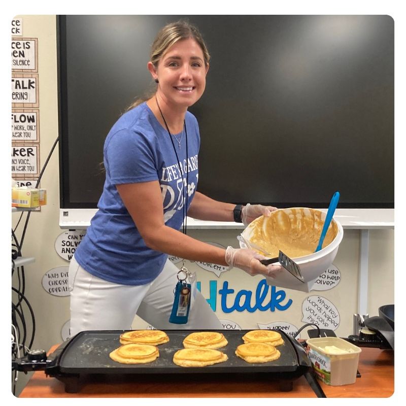 Third Grade Teacher Jane Lauzon displaying sweet potato pancakes
