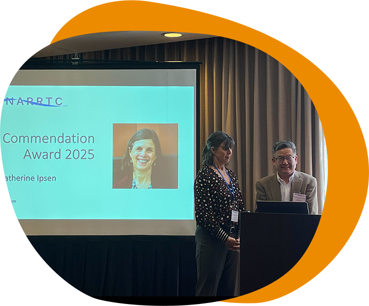Dr. Catherine Ipsen accepts a commendation award from a NARRTC representative.