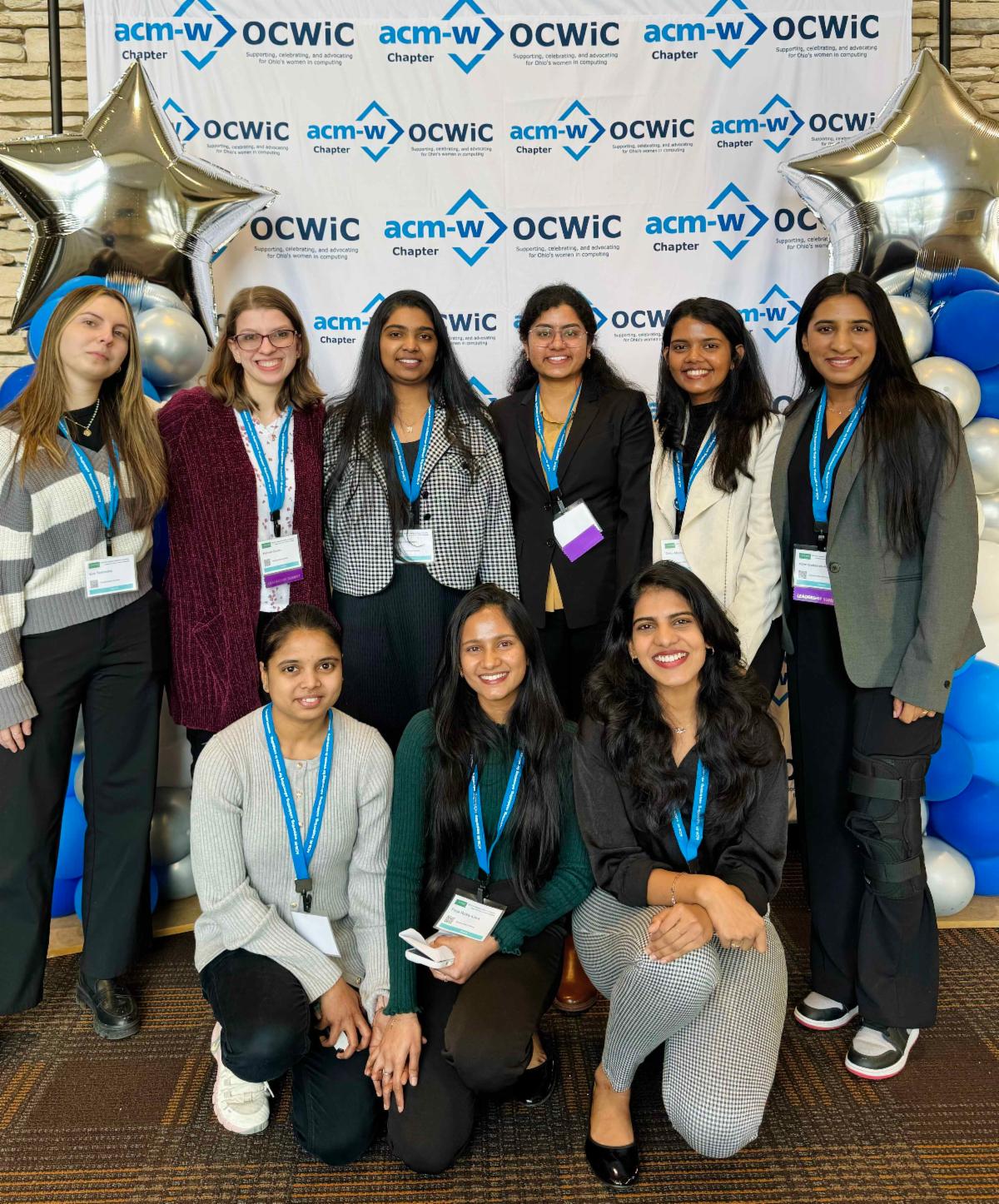 From left-to-right. Top row: Eva Ternovska, Hannah Simon, Harika Ummaneni, Avala Sushma, Dinky Mishra, and Adya Hindalahally Nagesha. Bottom row: Ramya S Vanamamulai, Poojareddy Arava, and Pavani Napa. 
