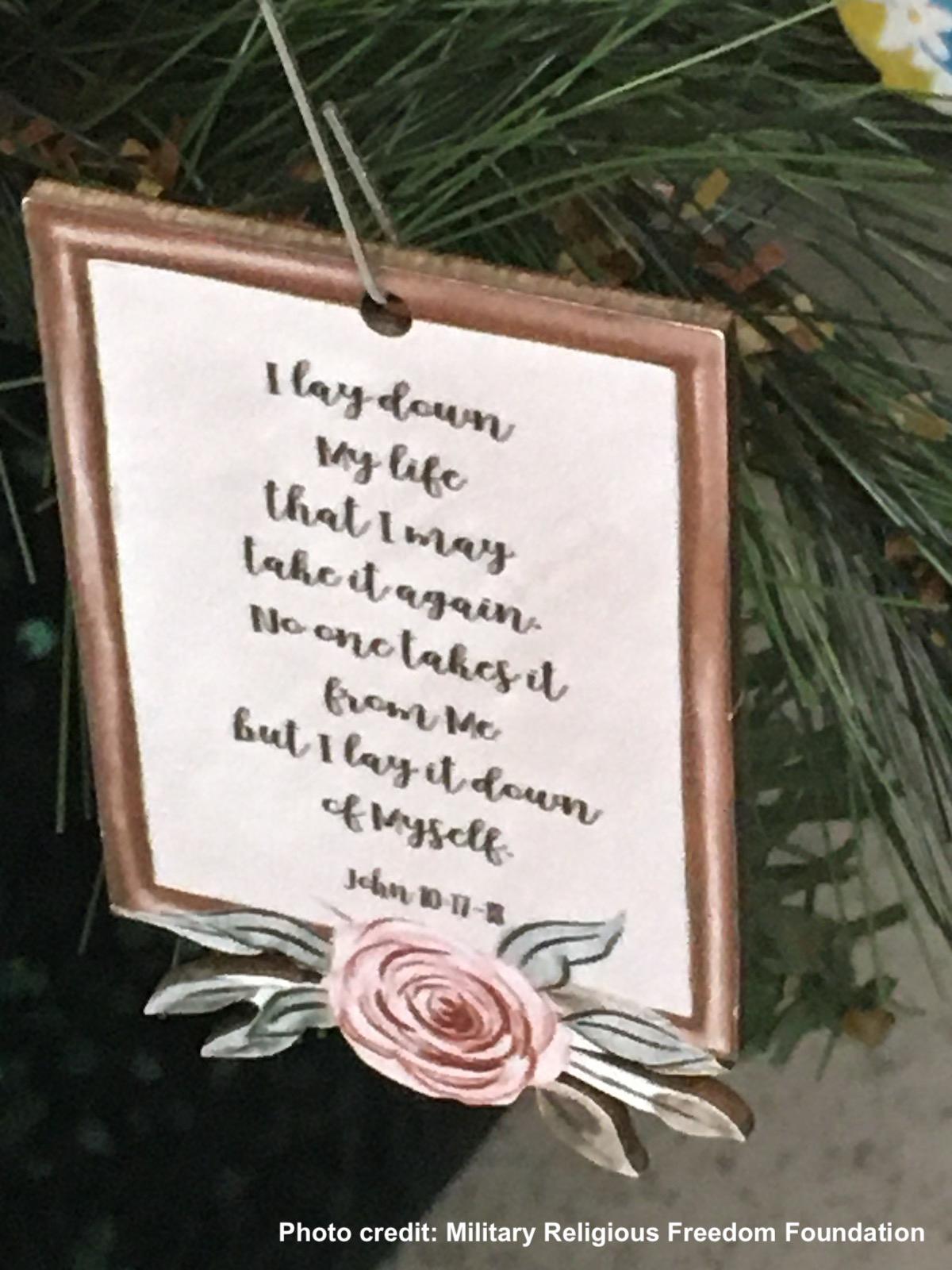 Close up of bible verse ornament on easter tree