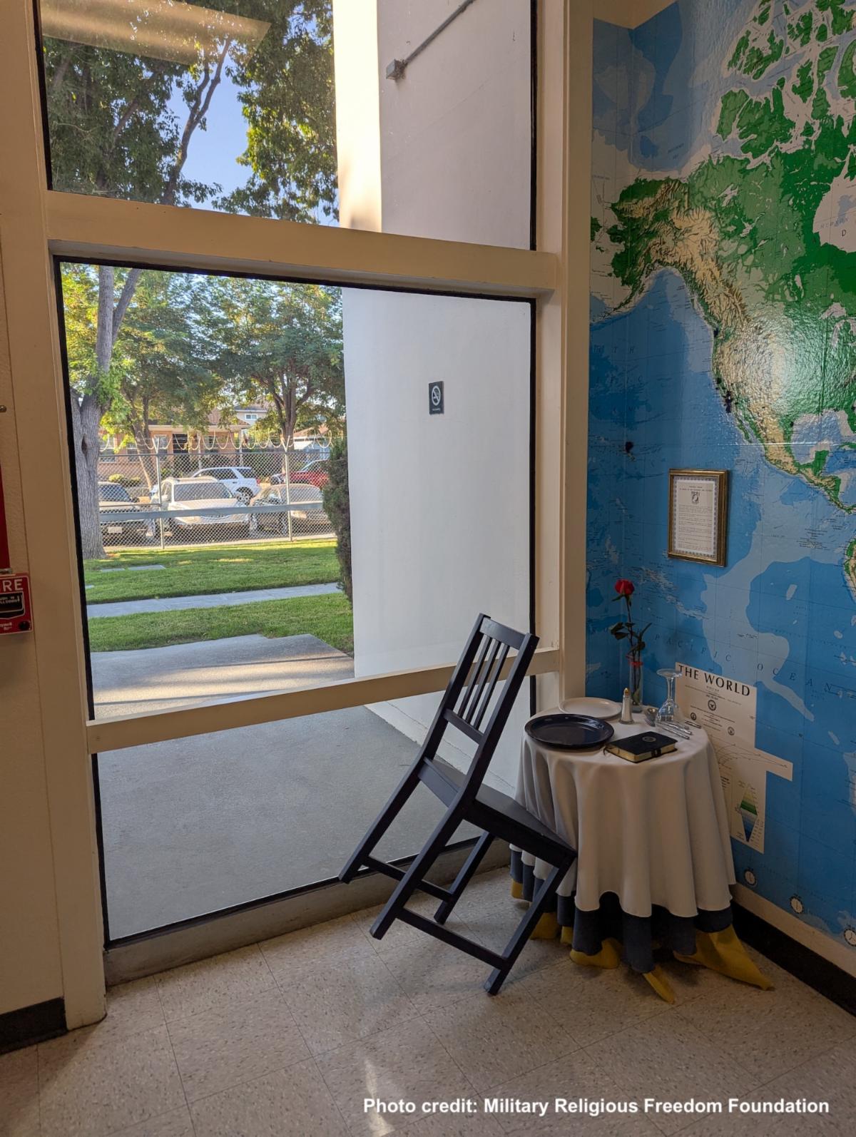 Photo taken from a distance shows location of table with Bible in Naval reserve center entrance