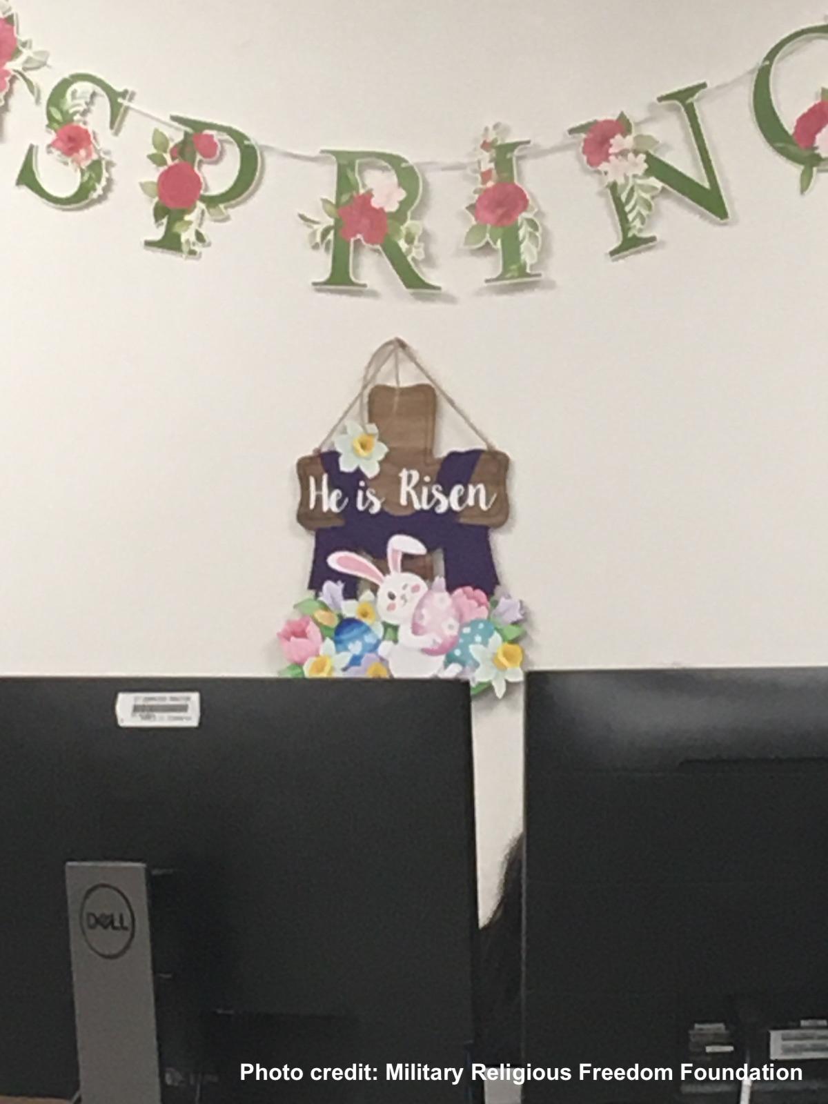Close up of he is risen sign in public computer area