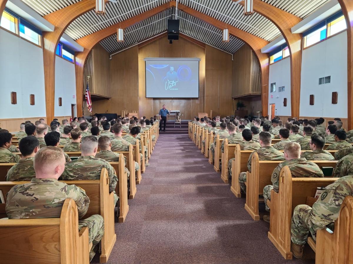 Photo showing packed chapel at mandatory Victor Marx training at Fort Wainwright
