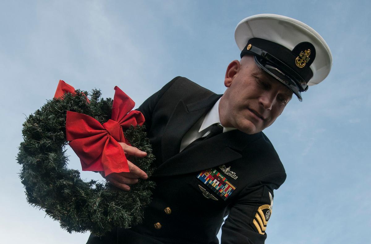 Military NCO holding Wreaths Across America wreath