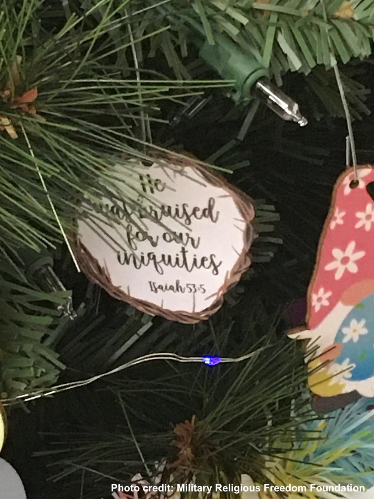 Close up of Bible verse ornament on easter tree