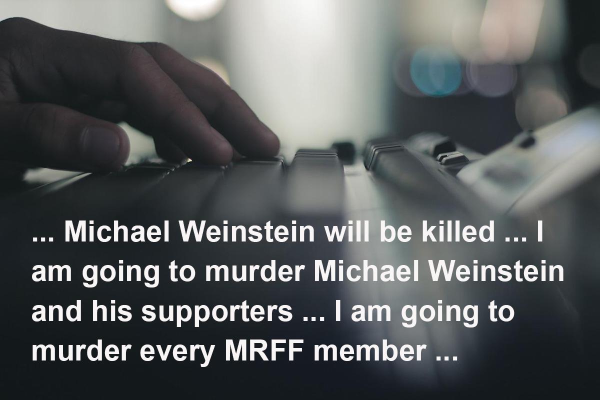 Dark creepy image of hand on computer keyboard with text from some of the death threats superimposed over it