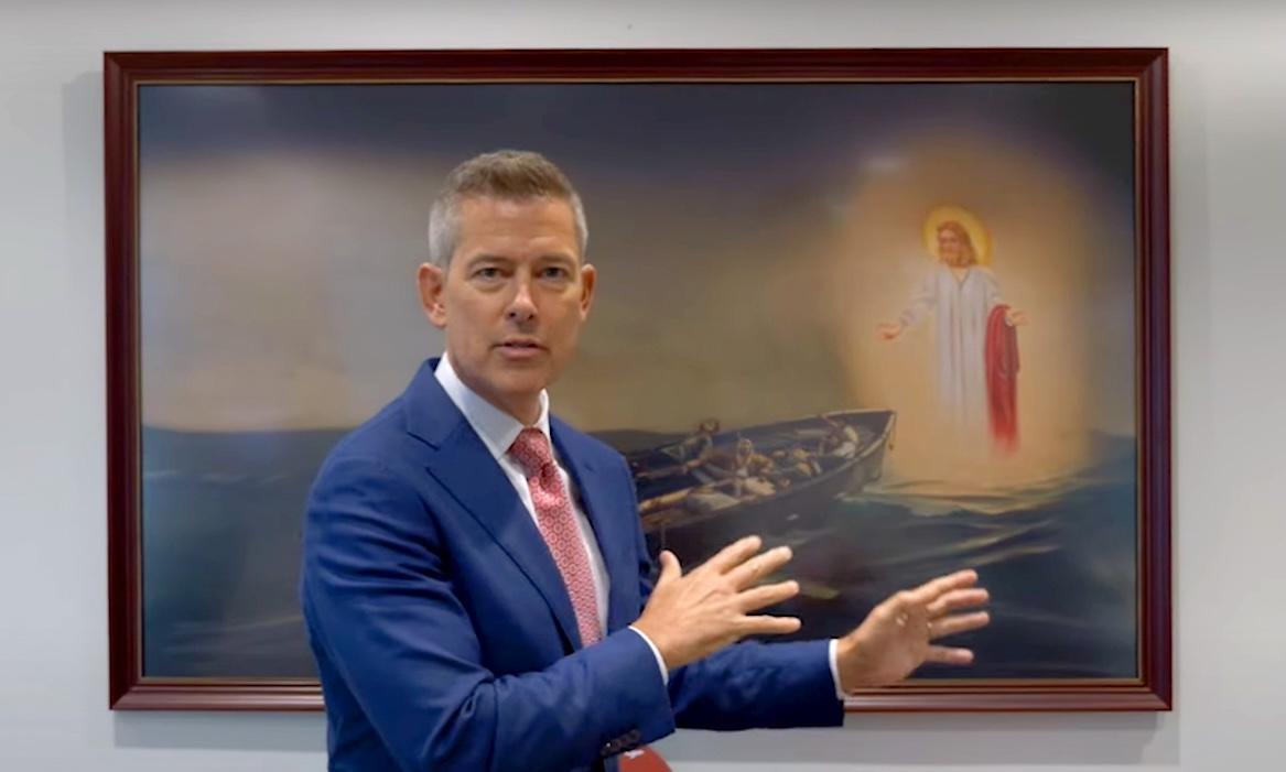 Sean Duffy with replica of giant Jesus painting in his DOT office