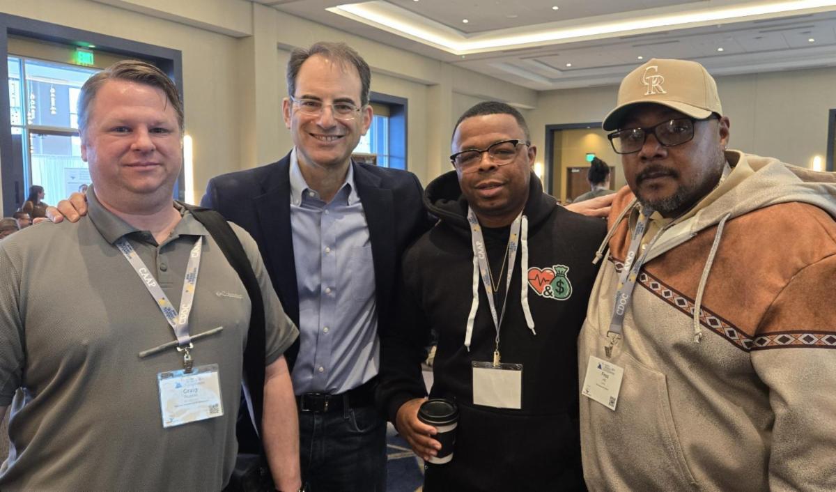 Attorney General Phil Weiser standing with peers from the Colorado Department of Corrections. 