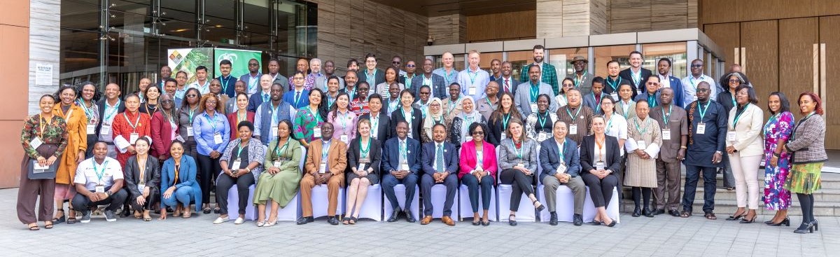 GWP Annual Conference attendees posing for a group photo outside.