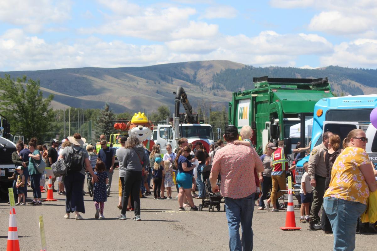 People walking around city vehicles at the 2023 Touch A Truck