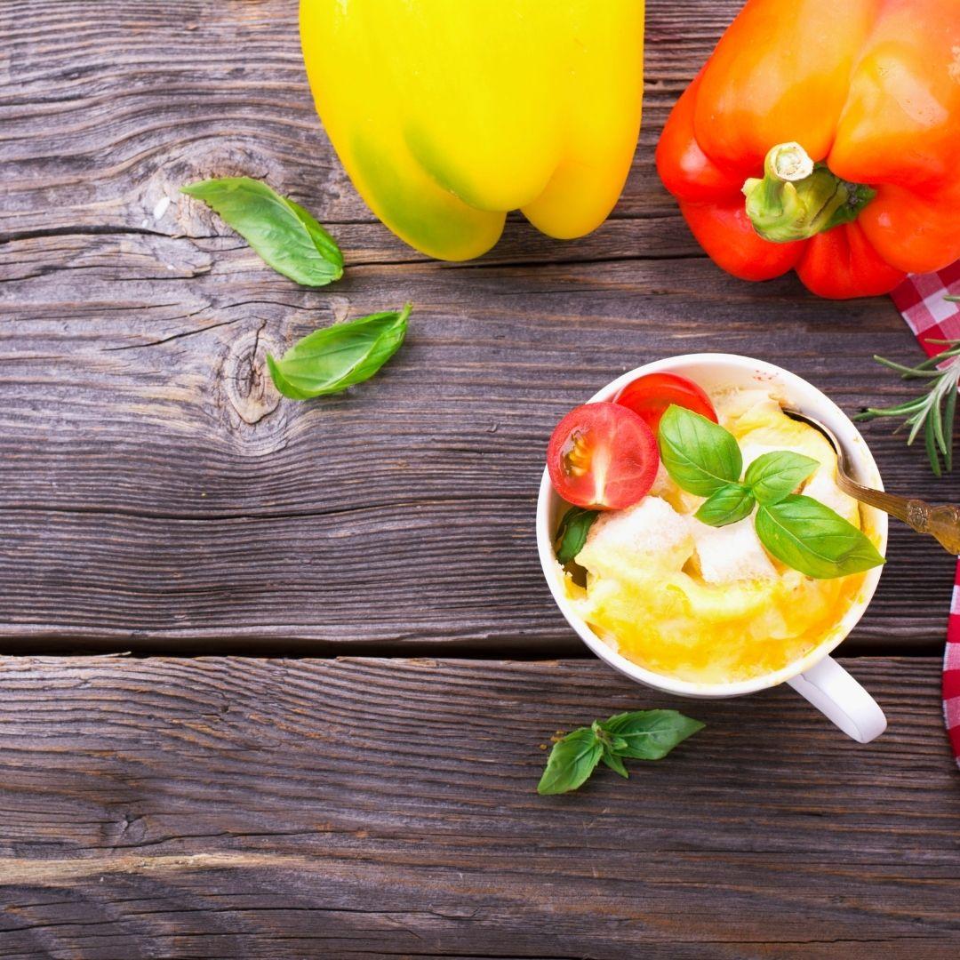 picture of bell peppers on a table as well as an omelet in a mug