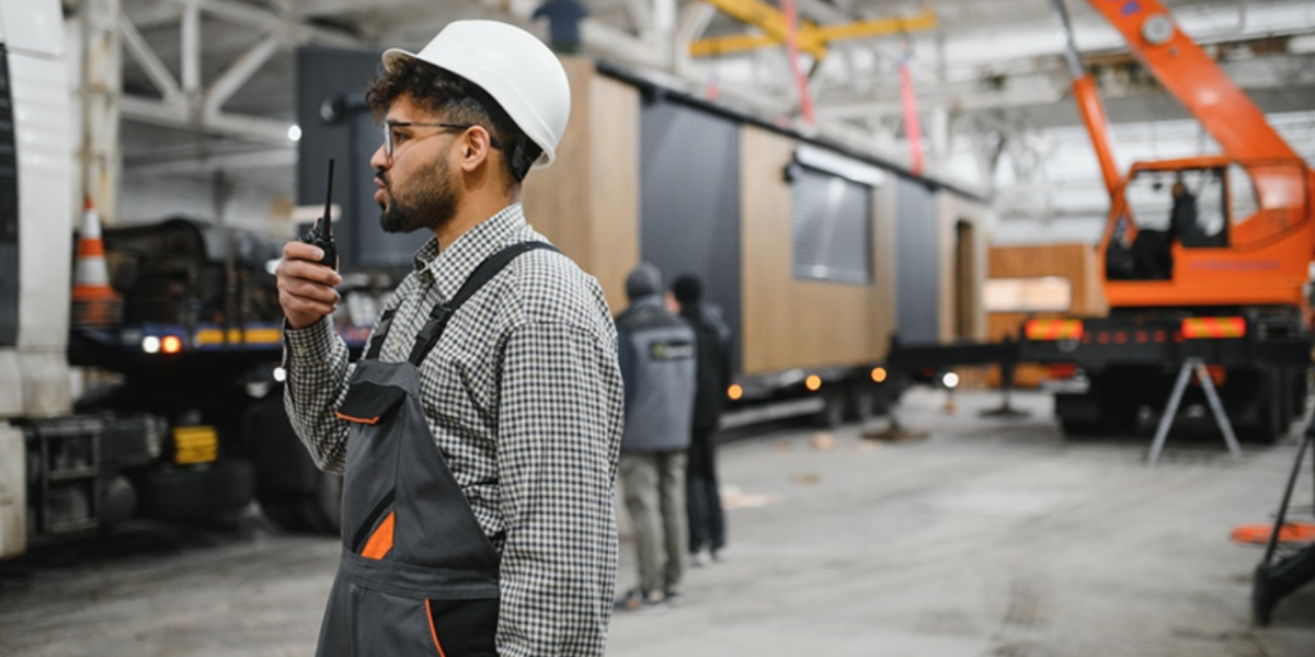 Photo of a person in a housing factory.