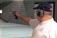 A shooter participating in a Harry Reeves memorial revolver shoot at the Fairbanks Fish and Game Range.