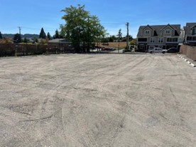 Another view of the gravel parking lot from the back looking towards the entrance.