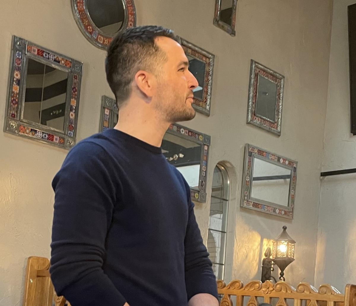 Peer Support Specialist Alex addressing members of the Kitsap Bar.