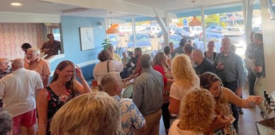 A group of adults talking and enjoying each other.