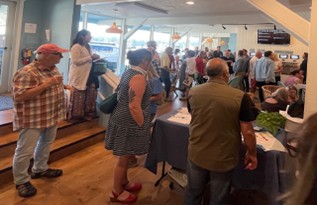 A group of people looking at a speaker.