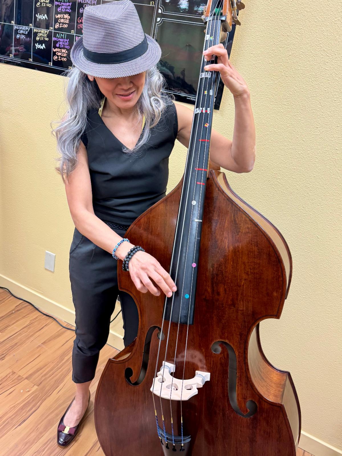 A woman playing cello.