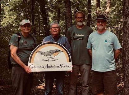 Eric Seaman Bill Mees Davis Nealey and John Besser at a Columbia Audubon Society preserve with trees in background