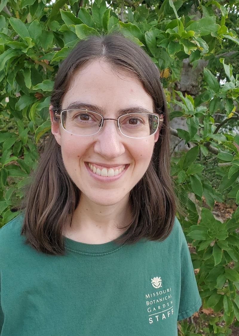 MoIP 2026 Awardee Brittany Shultz. She has brown hair and glasses witih clear frames. She has a green Missouri Botanical Garden t-shirt on.