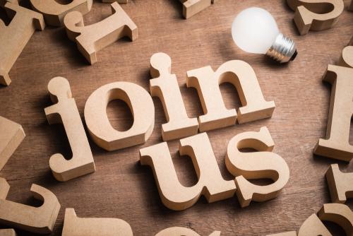 Wooden letters spelling out "join us"